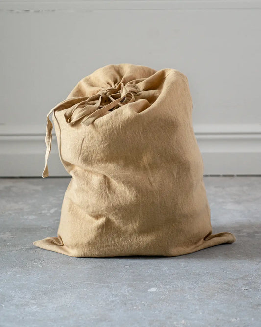 En senapsgul mellanstor tygpåse i linne