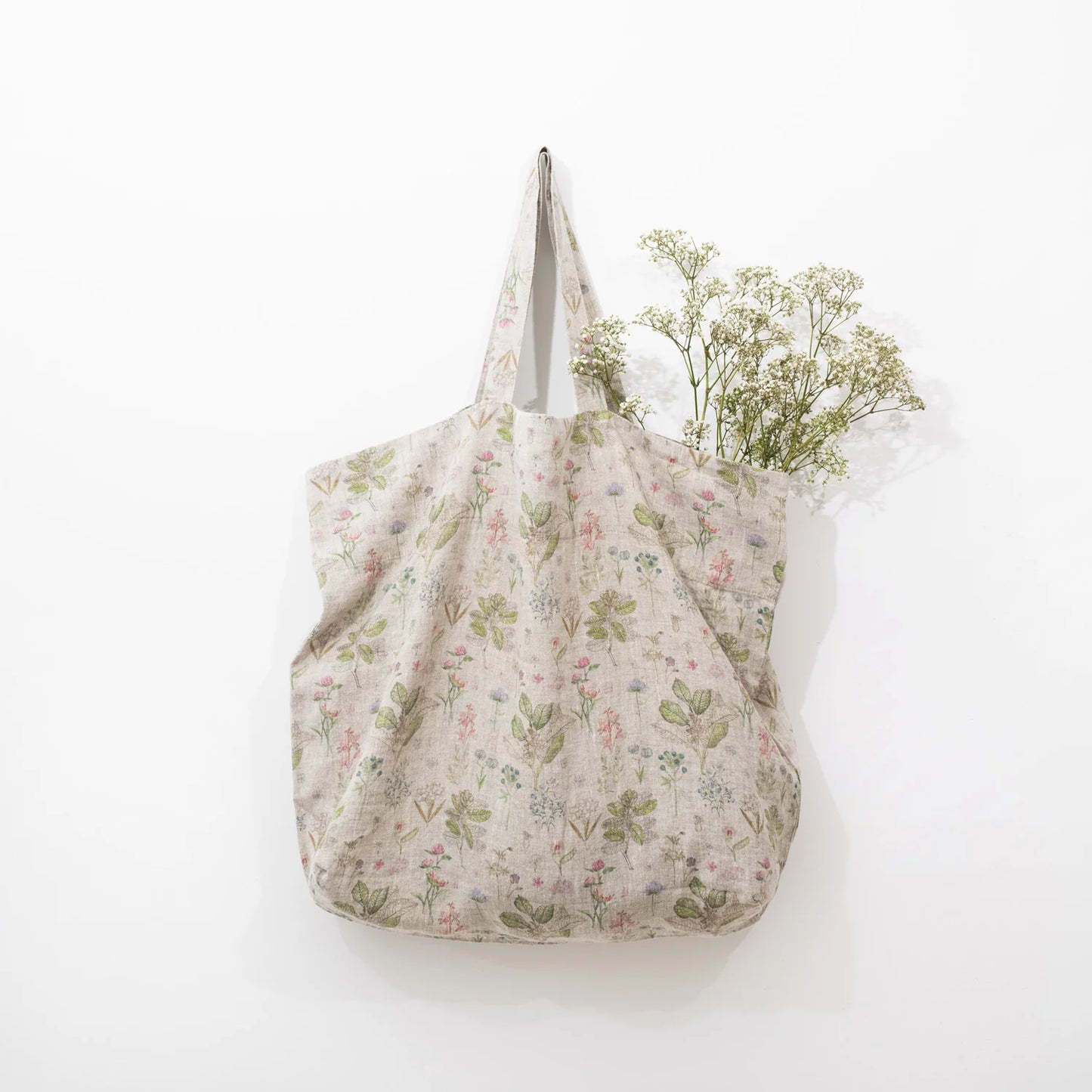 Tygpåse med blommor och blad