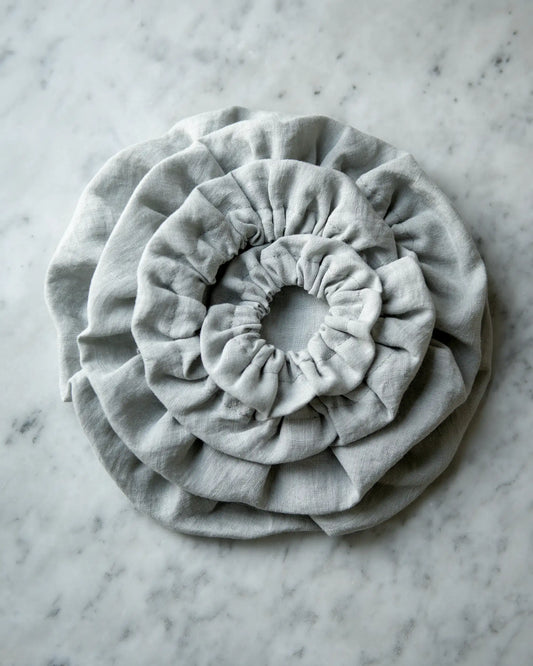 Handsydda ljusgrå skålöverdrag i 100% linne.